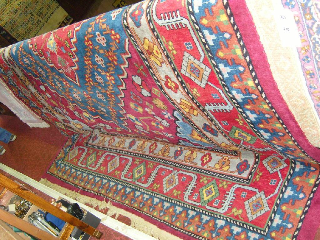 Appraisal: A large wool carpet in the eastern style with brightly