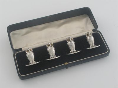 Appraisal: An Edwardian cased set of four owl menu holders with