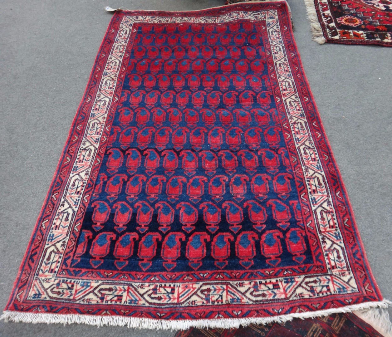 Appraisal: A Saraband rug Persian the indigo field with rows of