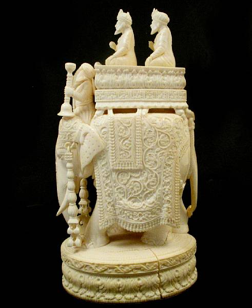 Appraisal: A carved Indian ivory figure of an elephant and two