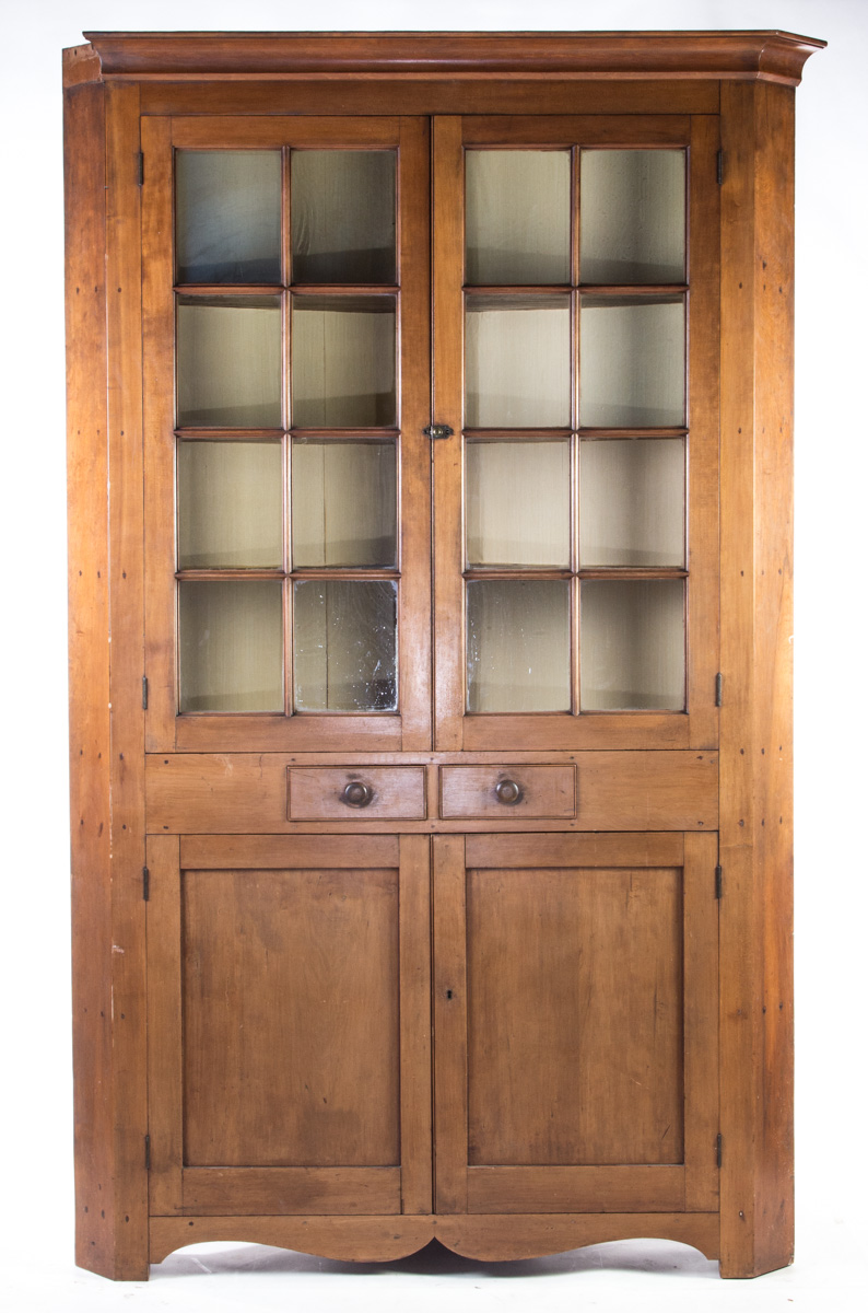 Appraisal: ONE-PIECE SIXTEEN-PANE CORNER CUPBOARD American nd quarter- th century cherry