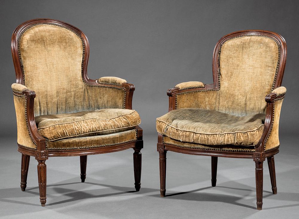 Appraisal: Two Antique Louis XVI-Style Carved Mahogany Bergeres each with molded