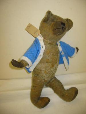 Appraisal: A pre-war English teddy bear with mother of pearl button