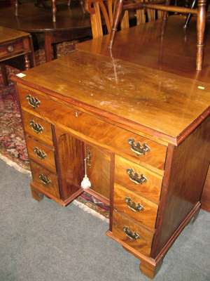 Appraisal: A Georgian style mahogany kneehole desk th century with frieze