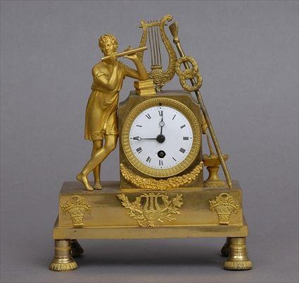 Appraisal: EMPIRE GILT-BRONZE FIGURE CLOCK The in enameled dial within petal