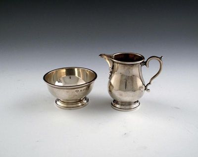 Appraisal: A silver cream jug and sugar bowl maker's mark of