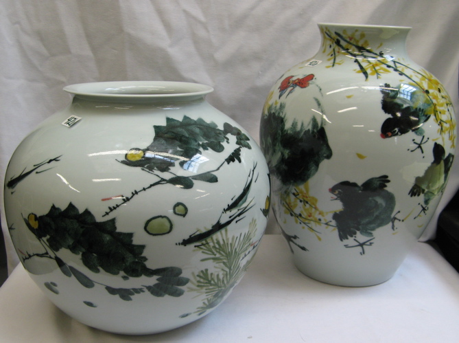 Appraisal: TWO CHINESE DECORATIVE PORCELAIN VASES in complementary bird and mammal