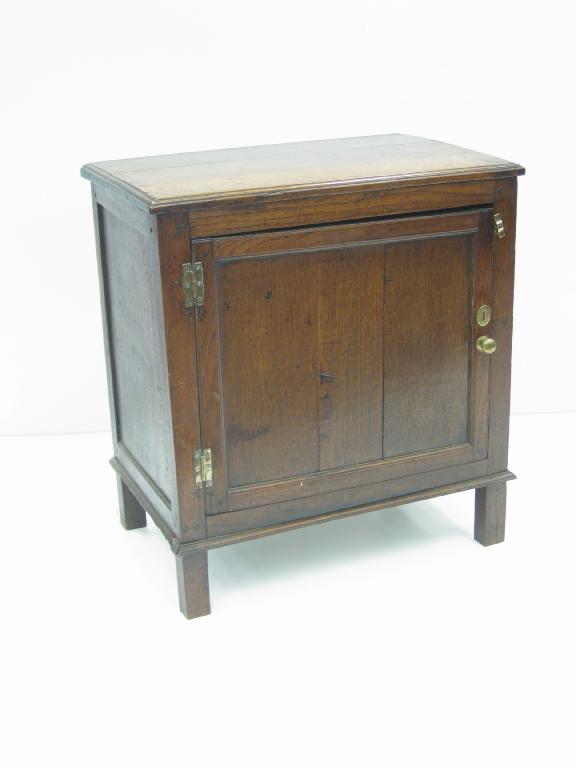 Appraisal: An th Century small oak Cupboard with single solid panel