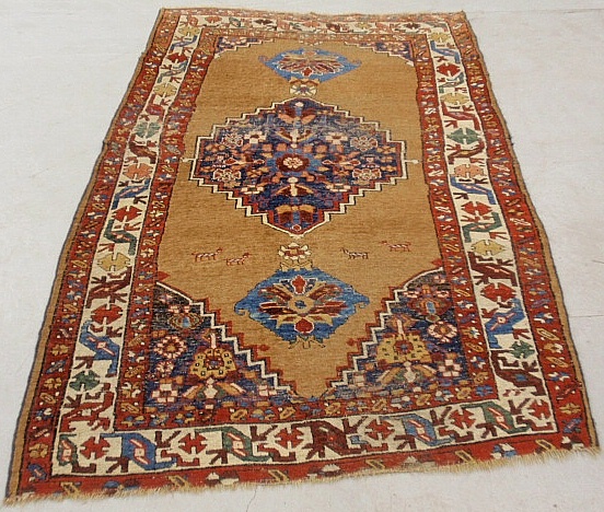 Appraisal: - Kazak oriental carpet with brown field and geometric patterns