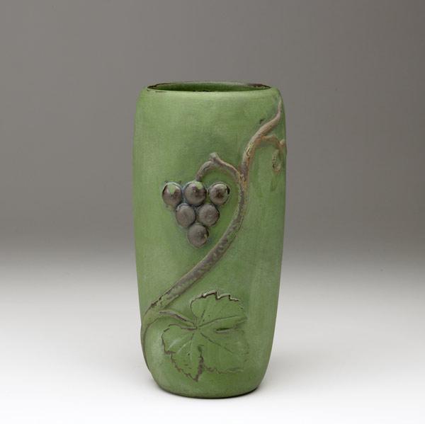 Appraisal: WELLER Kenova matte green vase with grapes Some firing chips