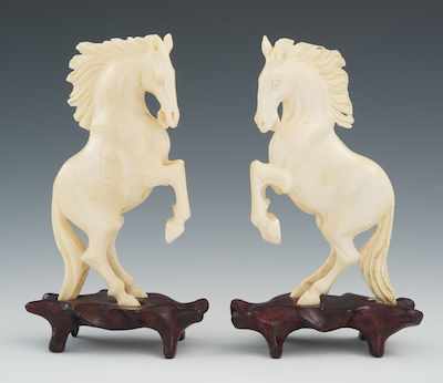 Appraisal: A Pair of Carved Ivory or Bone Horses on Wood