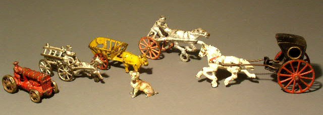 Appraisal: Five metal toys and a cold painted dog largest is