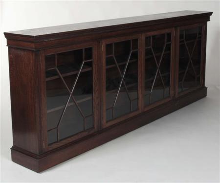 Appraisal: An early th century oak low bookcase the projected moulded