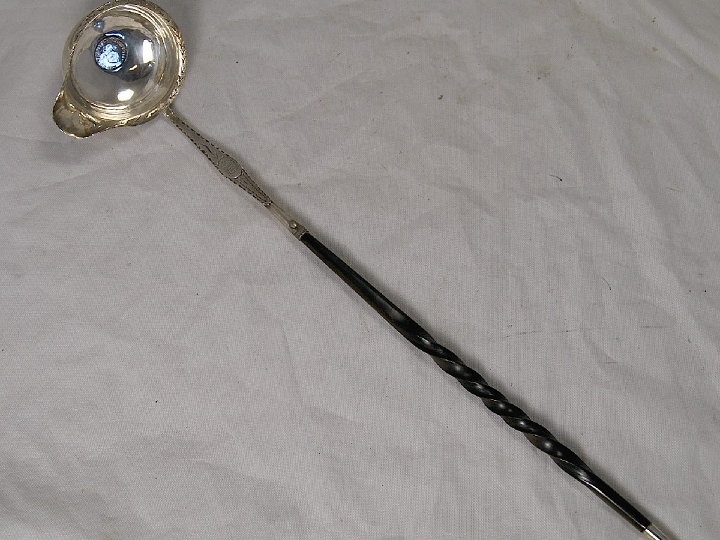 Appraisal: Georgian bright cut silver punch ladle having silver coin inserted