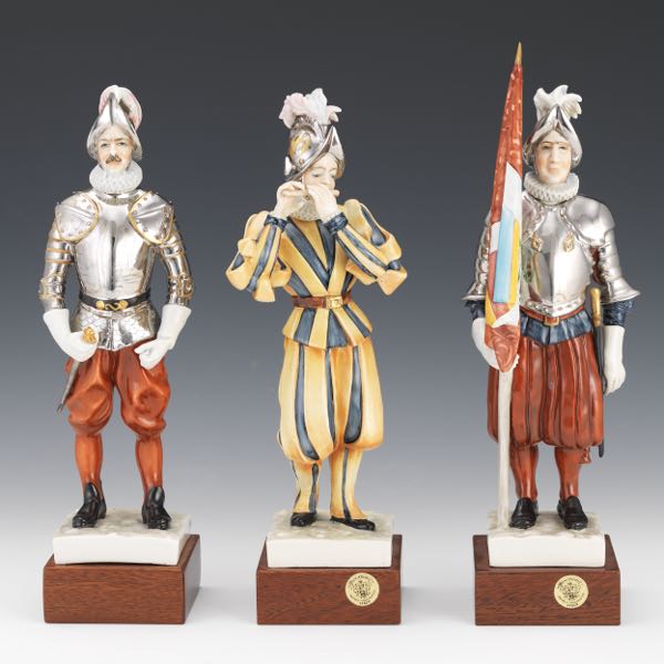 Appraisal: THREE ITALIAN HOUSE OF GOEBEL SWISS GUARD PORCELAIN FIGURINES x