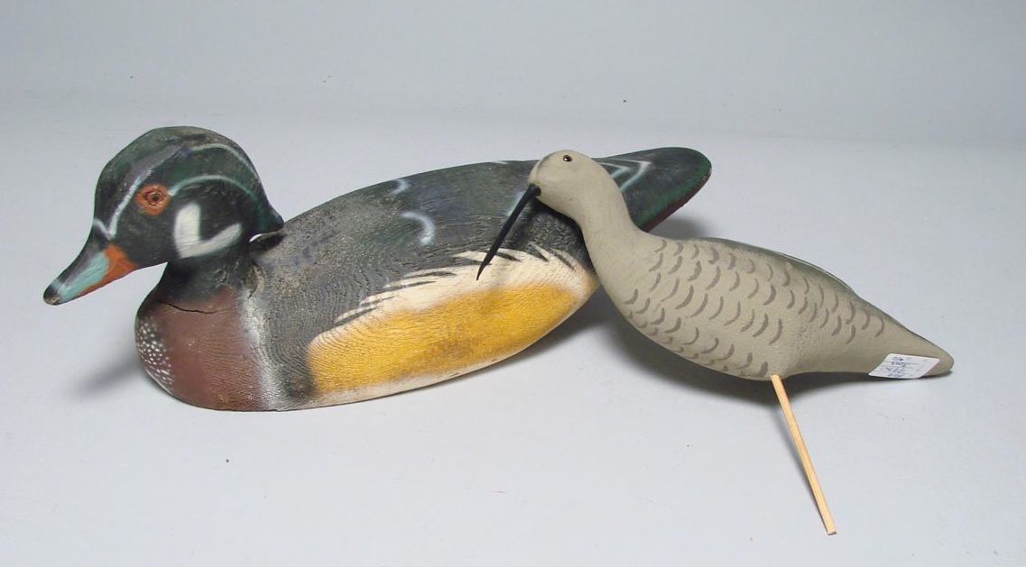 Appraisal: TWO HERTER'S FACTORY DECOYS Woodduck drake and a curlew Mint