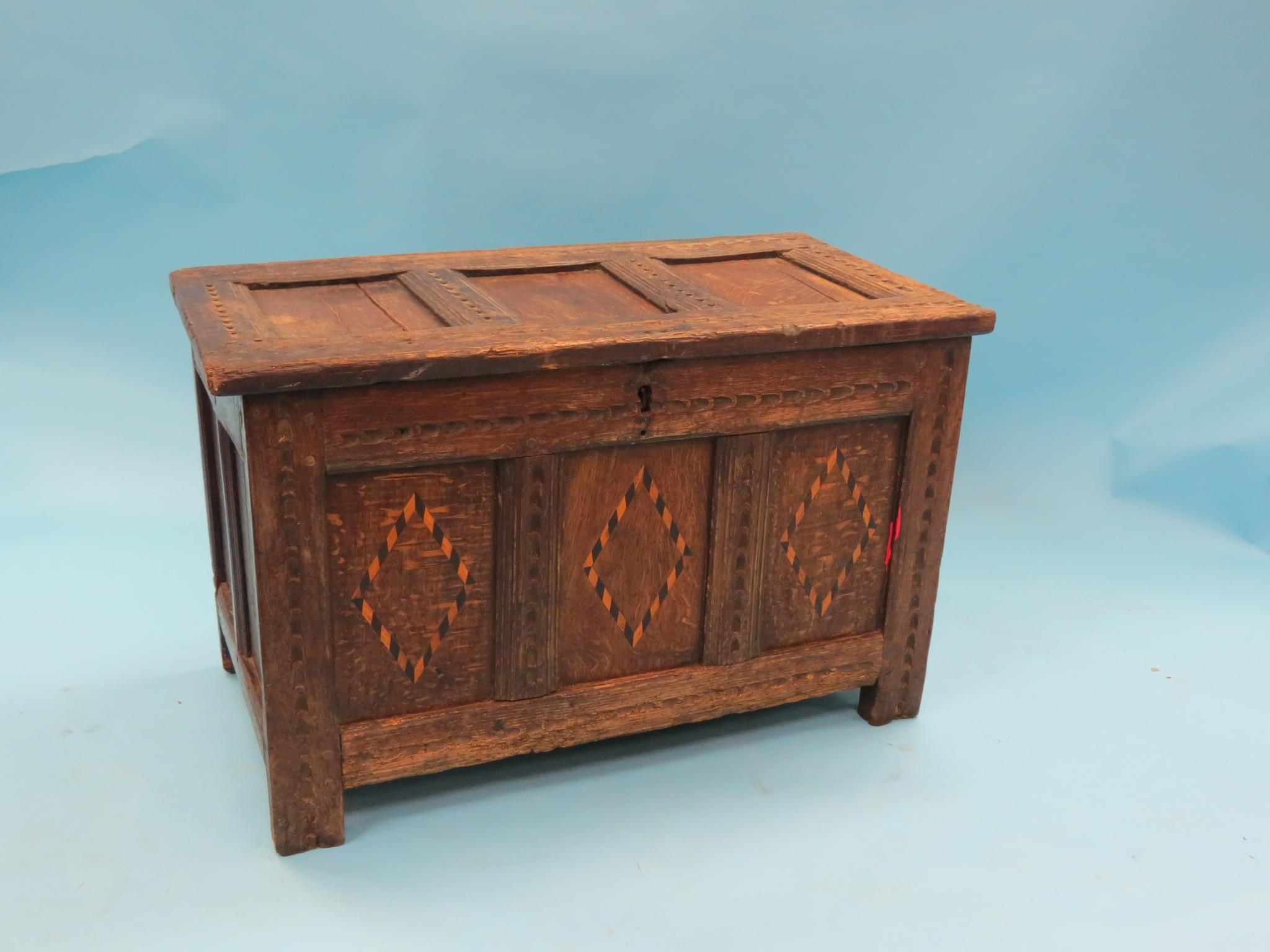 Appraisal: A th century inlaid oak coffer panelled construction with gouged