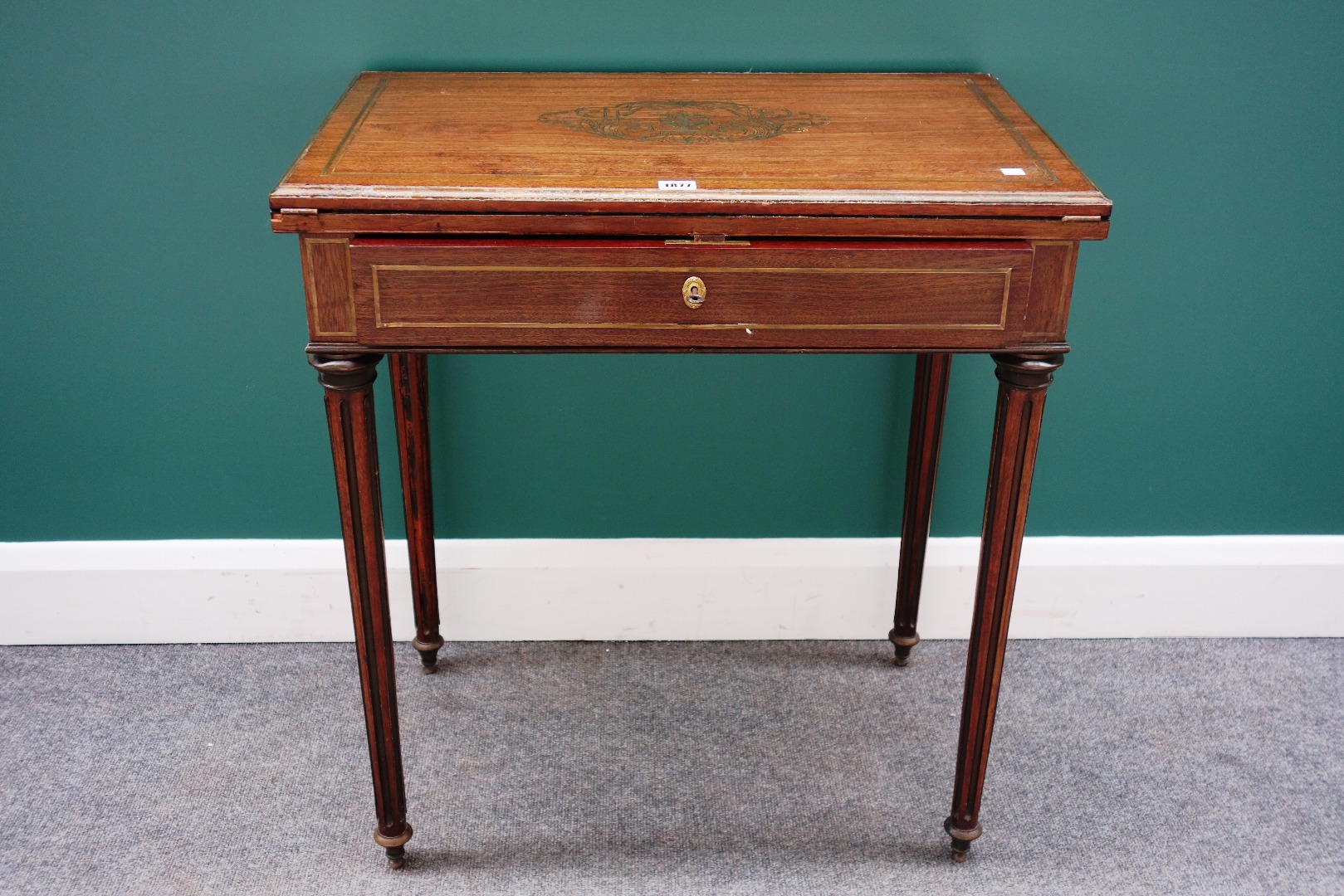 Appraisal: A late th century French brass inlaid mahogany card table