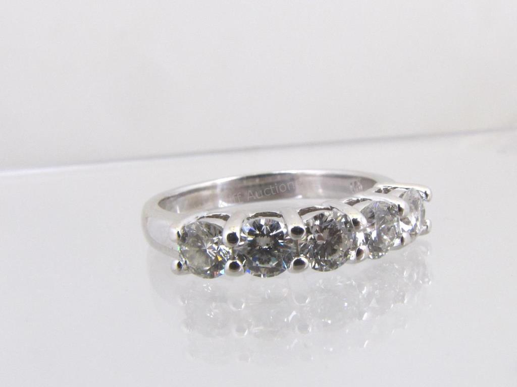 Appraisal: A K white gold five diamond band containing approximately five