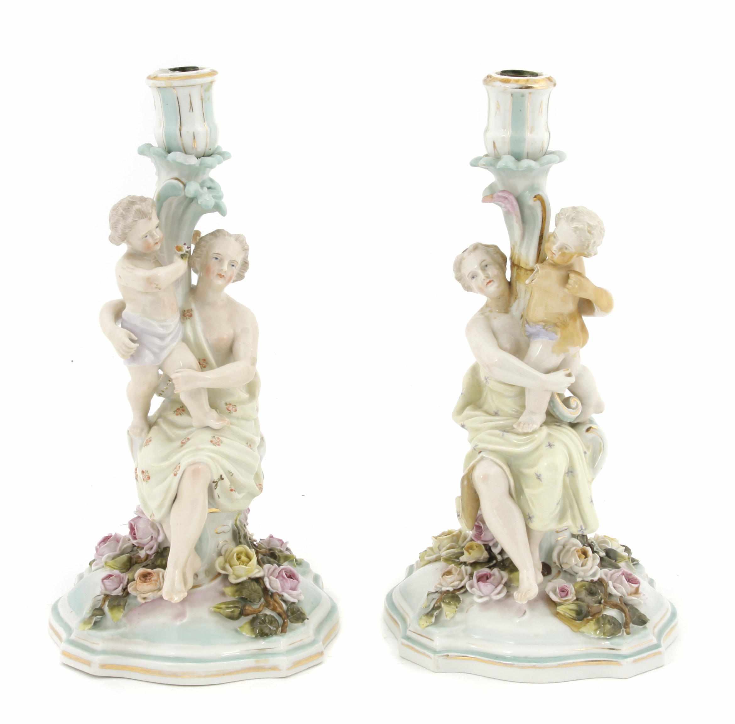 Appraisal: A pair of Sitzendorf porcelain figural candlesticks early th centuryWith