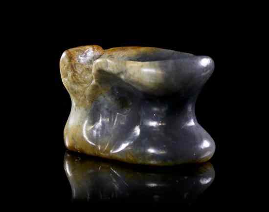 Appraisal: A Jade Toggle in the form of a vertebrae of