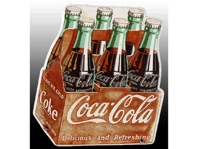 Appraisal: Coca-Cola Tin -Pack Die-Cut Sign Description Extensive fading Clear coated