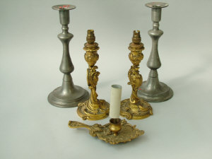 Appraisal: A pair of French rococo style ormolu candlestick lamp bases