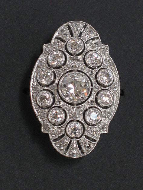 Appraisal: AN ART DECO DIAMOND DRESS RING with stylised marquise-shaped platform