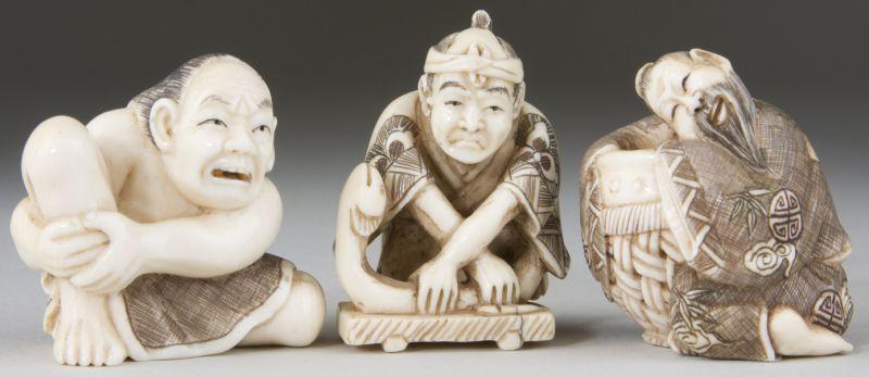 Appraisal: Three Ivory Netsukes tinted and artist signed a wrestler with