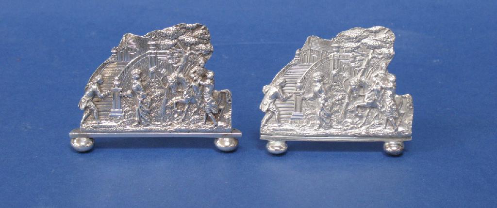 Appraisal: A MATCHED PAIR OF VICTORIAN MENU CARD HOLDERS each bearing