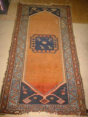 Appraisal: AN ANTIQUE NORTH WEST PERSIAN RUG the red field with