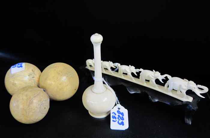 Appraisal: FIVE IVORY CARVED CHINESE PIECES three solid ivory toy balls