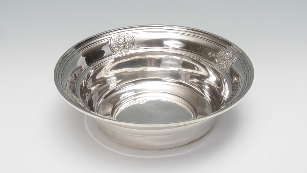 Appraisal: STERLING HAND CHASED BOWL WITH FLORAL DECOR floral medallions inside