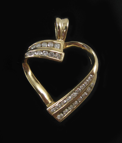 Appraisal: DIAMOND AND FOURTEEN KARAT GOLD PENDANT The yellow gold open