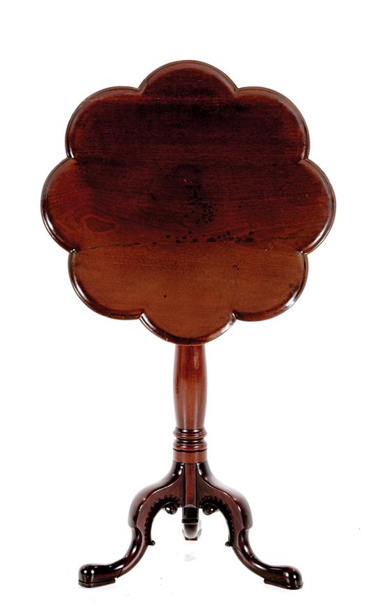 Appraisal: Georgian style carved mahogany tilt-top table late th century scalloped