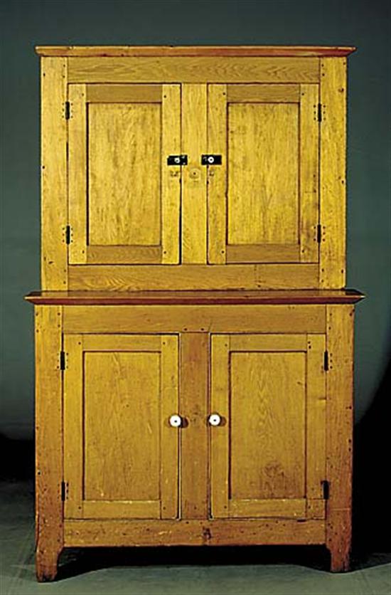 Appraisal: American ash stepped-back cupboard th centurycanted cornice over pair of