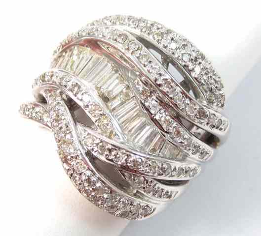 Appraisal: DIAMOND AND EIGHTEEN KARAT GOLD RING the heavy white gold