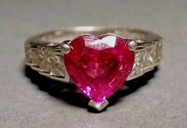 Appraisal: Platinum ruby and diamond ring size with a center heart