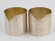 Appraisal: A pair of unusual Russian silver napkin rings each shaped