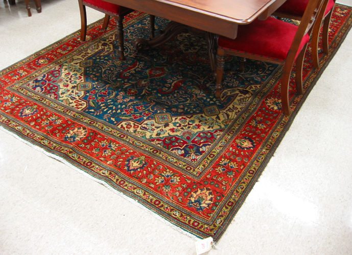 Appraisal: PERSIAN TABRIZ CARPET central floral medallion and surrounding scrolling floral