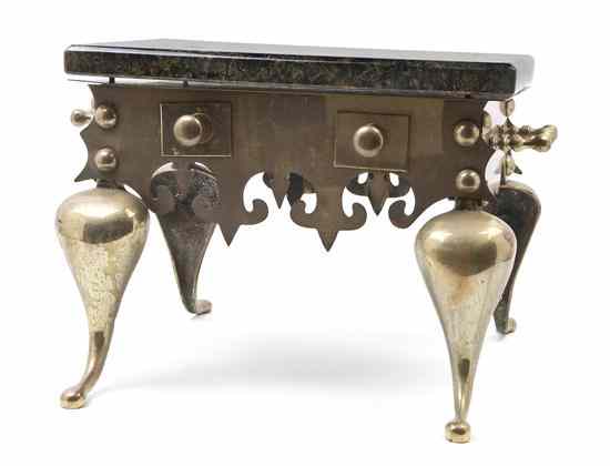 Appraisal: A Pair of Brass Footmen having a rectangular marble top