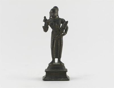 Appraisal: An Indian bronze figure of Yashoda standing holding the child