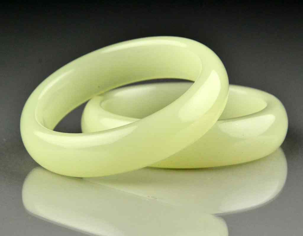 Appraisal: Chinese Jade Bangle BraceletsThe stone a light to white celedon