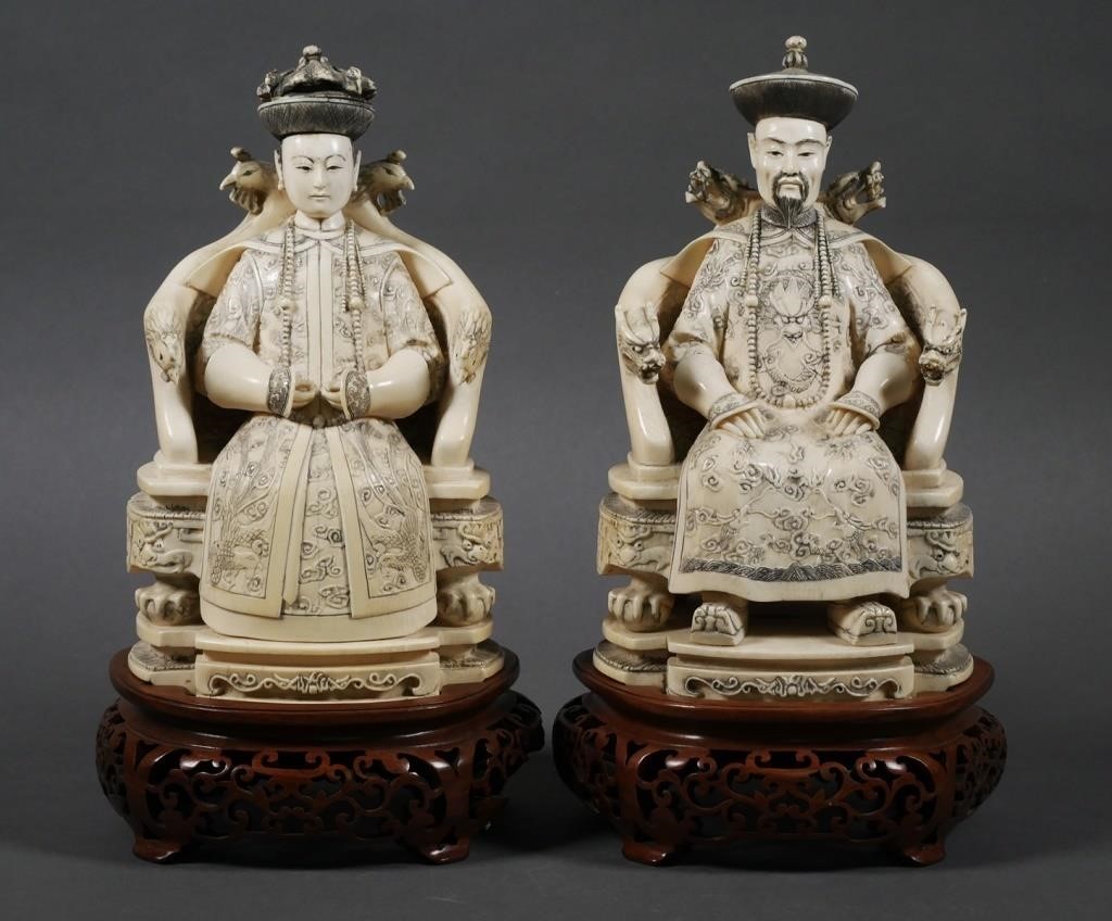 Appraisal: Carved antique ivory statues of a Chinese Emperor and Empress