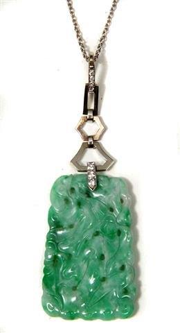 Appraisal: A SMALL JADE NECKLACE and a jade carved pendant on