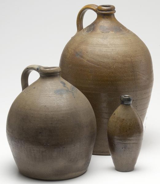 Appraisal: STONEWARE Two early th C ovoid jugs together with a