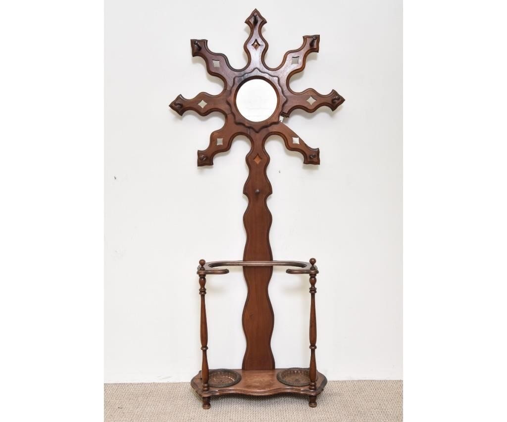 Appraisal: Victorian walnut hall rack with circular mirror and lower umbrella