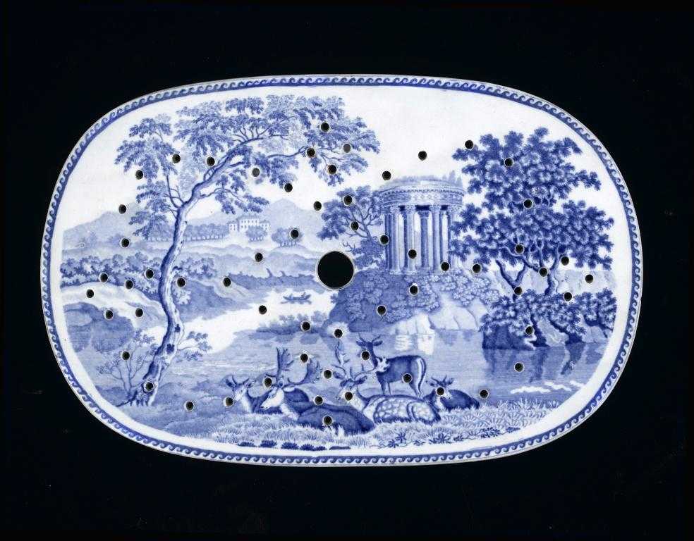 Appraisal: A BLUE PRINTED EARTHENWARE DRAINER with a deer park and