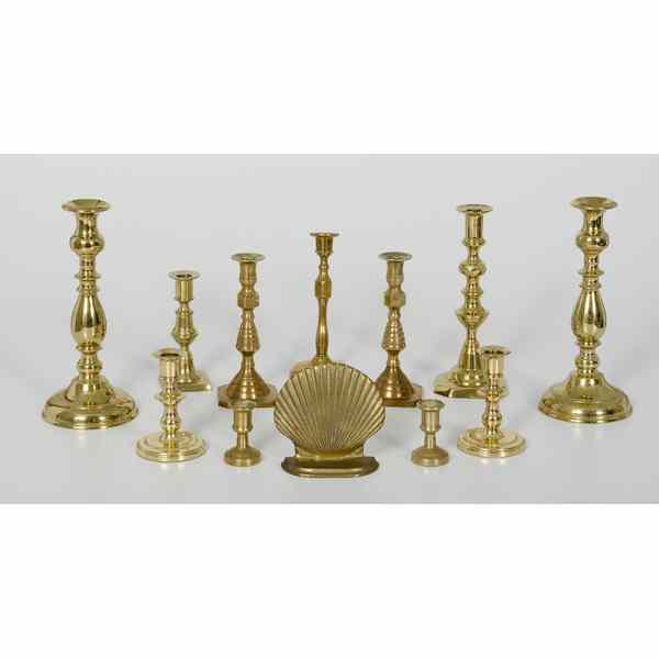 Appraisal: Brass Candlesticks Plus English An assembled group of eleven brass