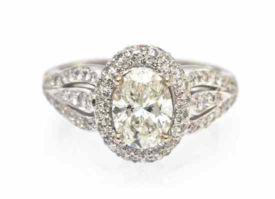 Appraisal: A Karat White Gold and Diamond Ring containing one oval